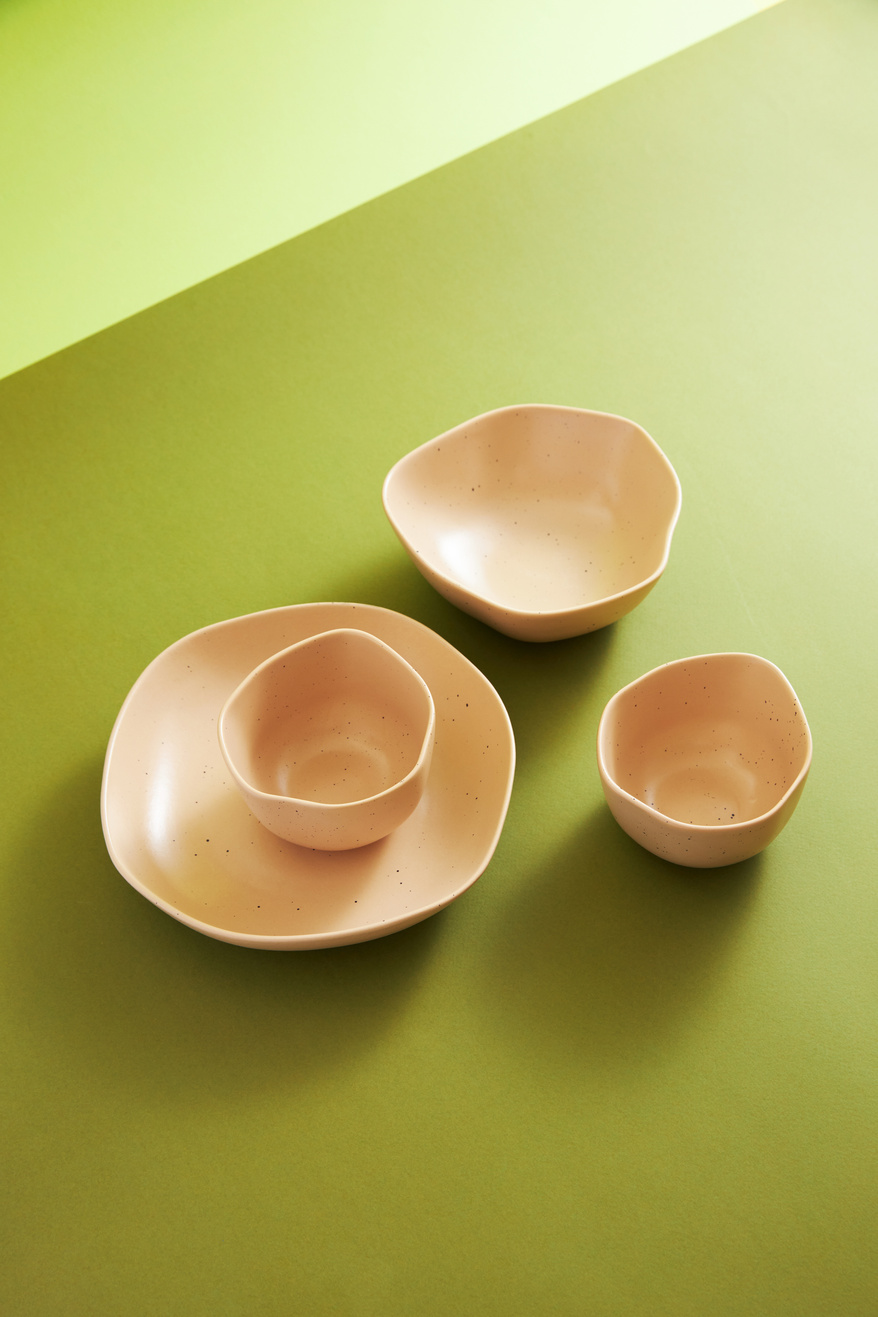Plate and Bowls on Green Background