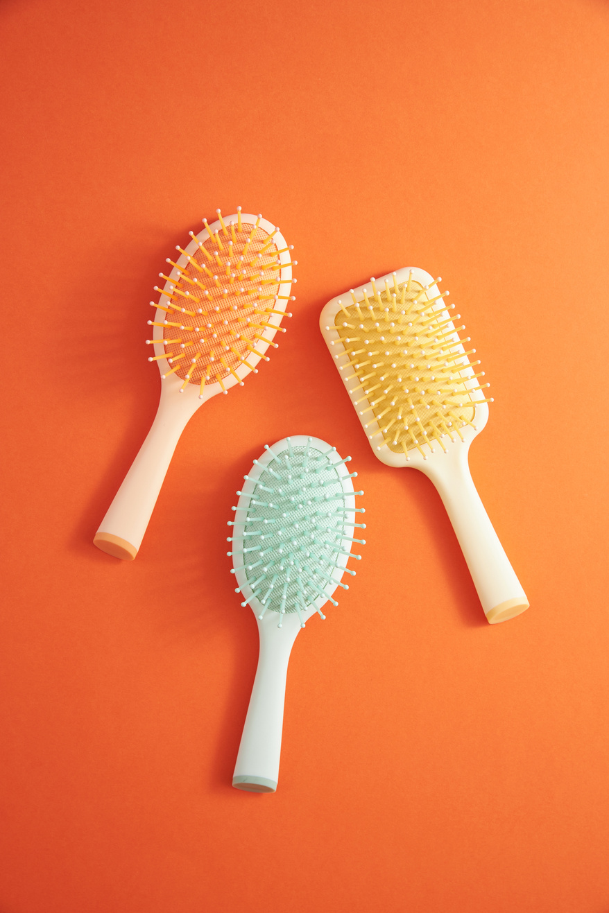 Hairbrushes on Orange Background