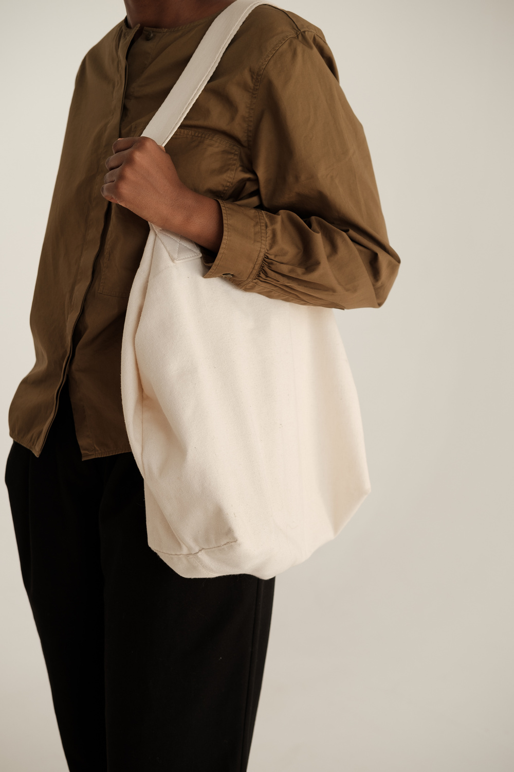 Woman in Dress Shirt with Tote Bag