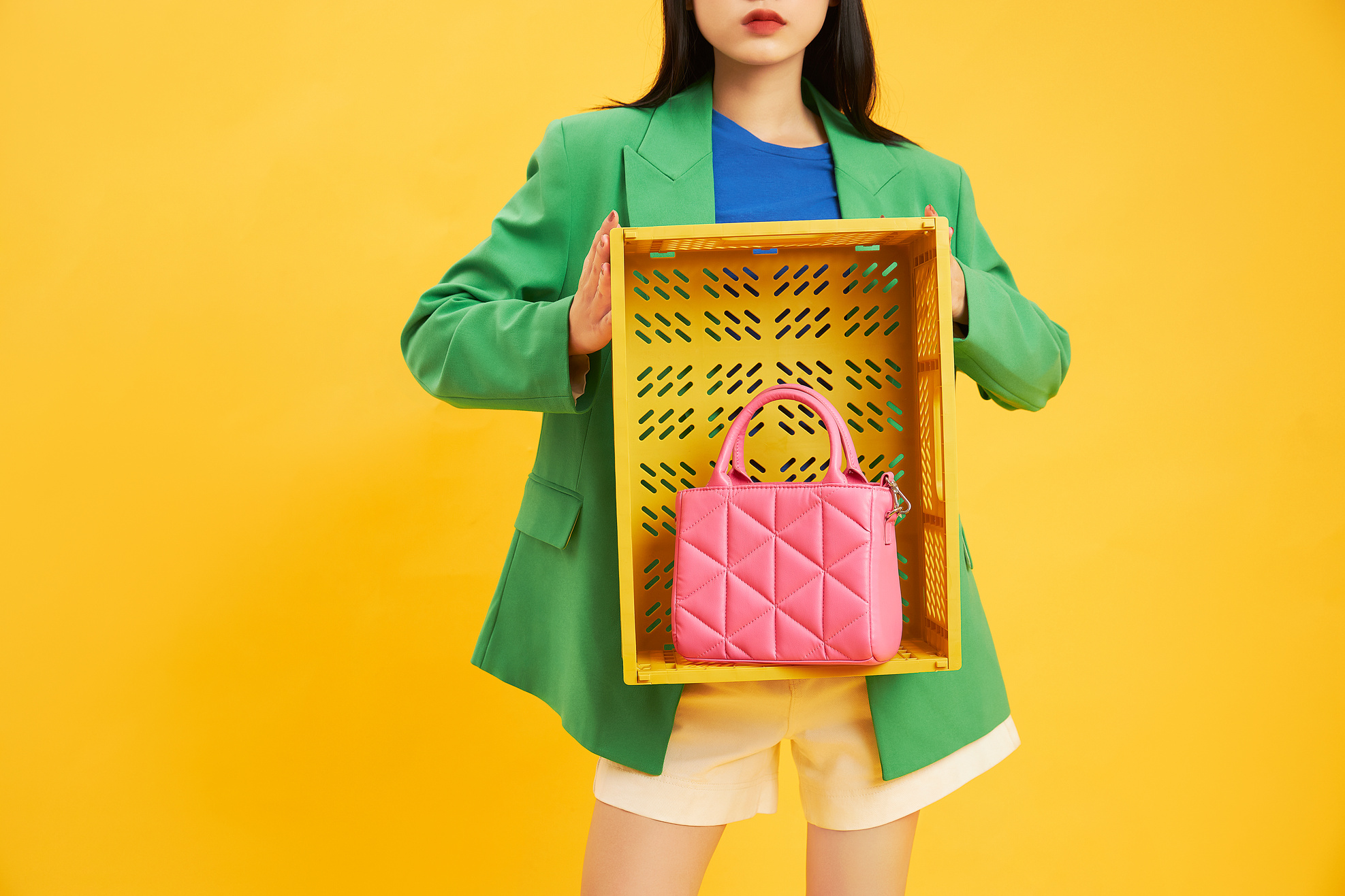Woman Holding a Yellow Organizer Box with Pink Bag