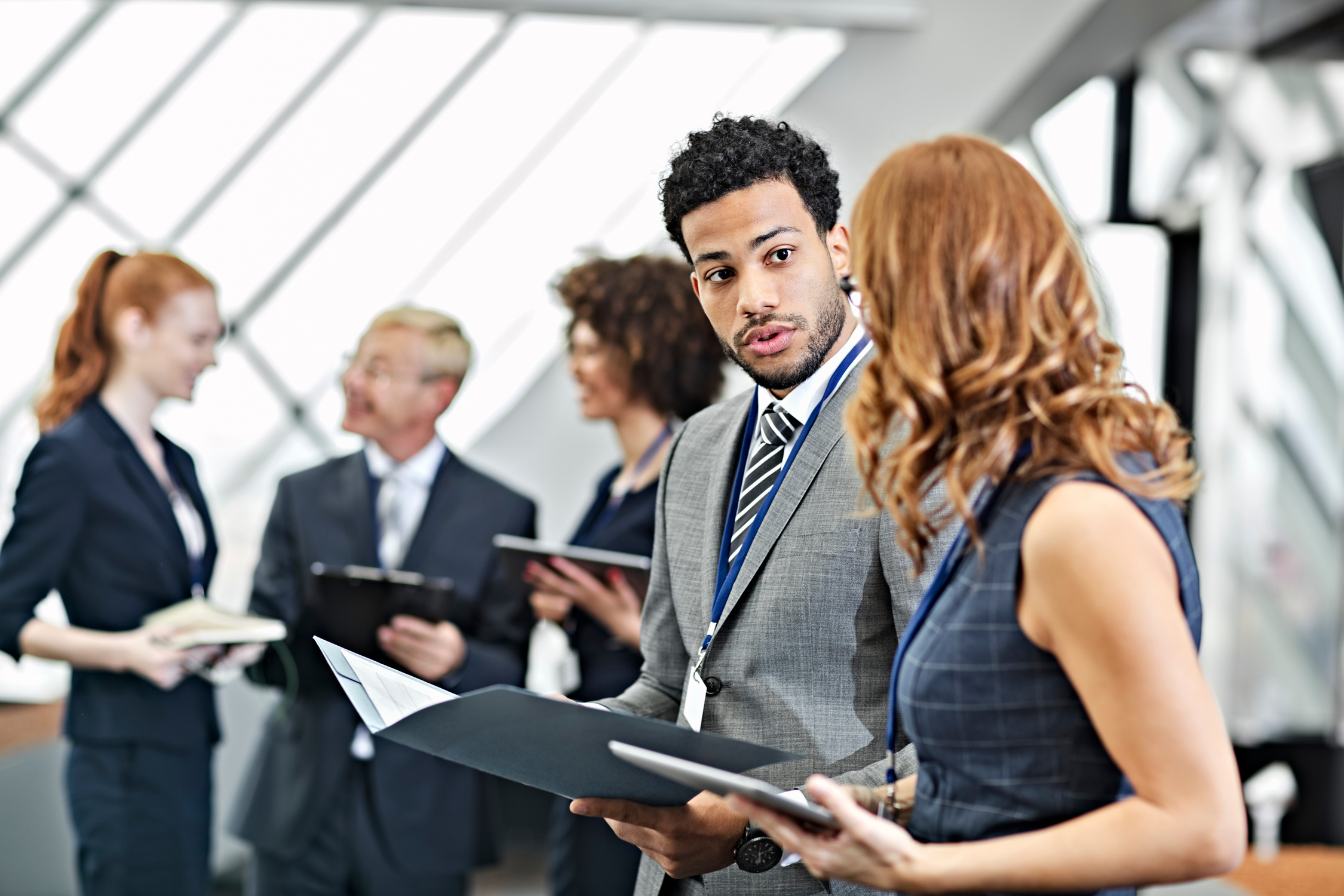 Business people comunicating at conference