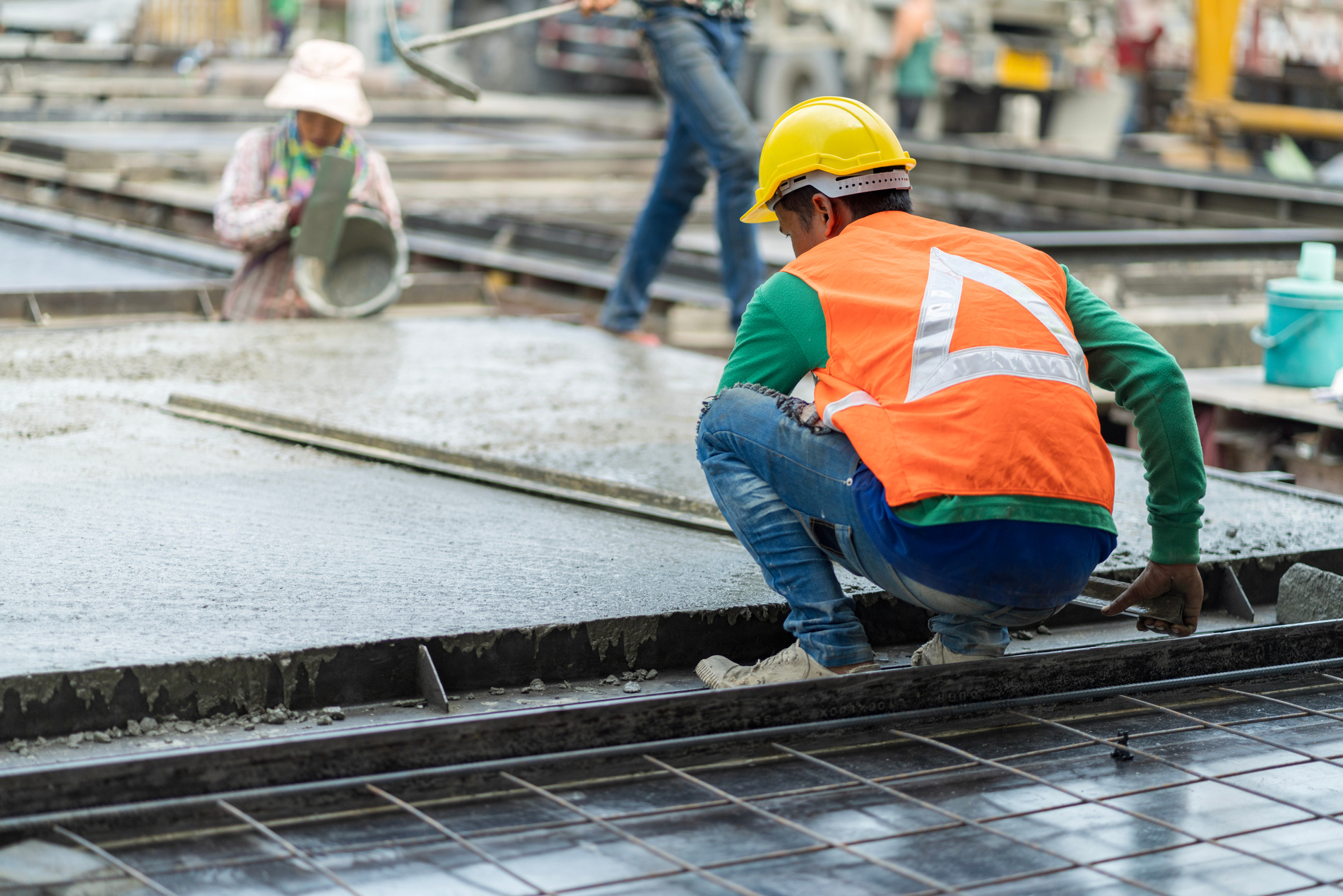 Male worker in a precast wall factory (Precast) is forming a wal